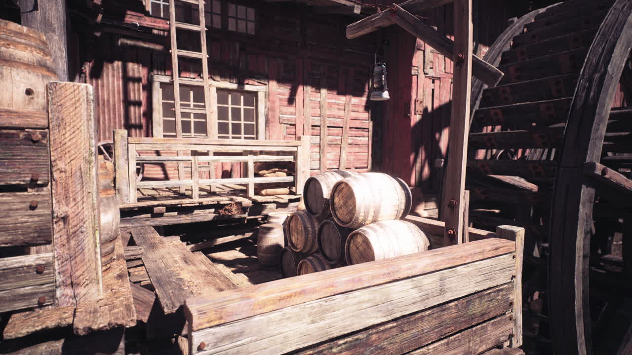 Rustic setting with wooden barrels and water wheel in an old structure