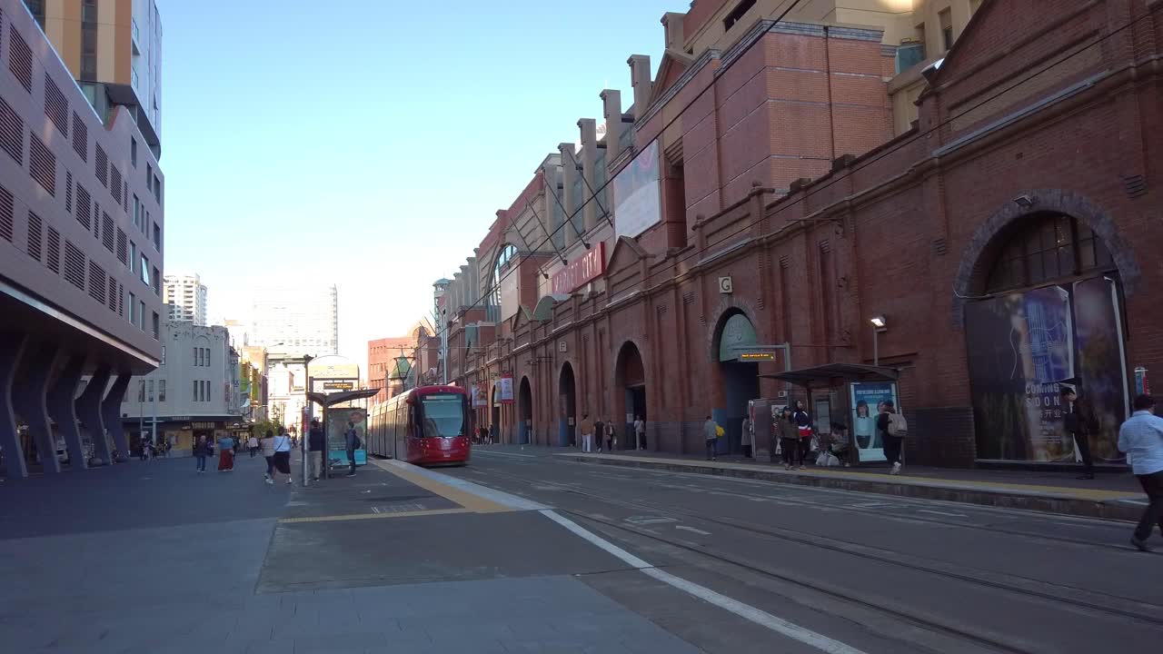 Sydney Tram departing in front of Paddy's Market at Market City, Sydney CBD.