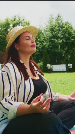 serenity in nature: a woman embracing mindfulness and tranquility in a beautiful garden, cultivating inner peace through meditation and sunlight