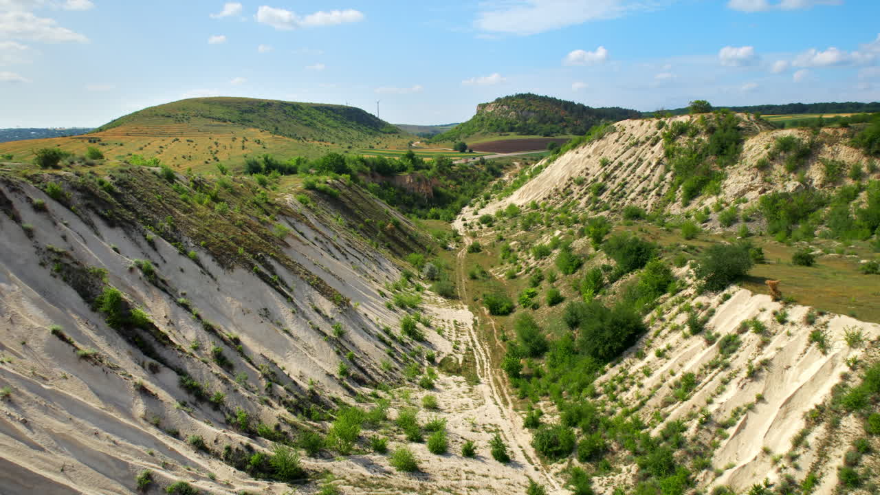 Aerial drone view of the Little Switzerland of Moldova located in Fetesti. Former limestone quarry with slopes covered with greenery