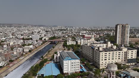 drone footage of jaipur skyline showcasing a mix of modern and traditional architecture