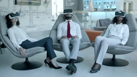 Relaxed coworkers in vr headsets
