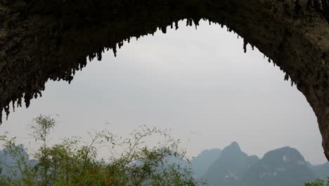 moon hill arch with stalactites and mountainous landscape on a cloudy day