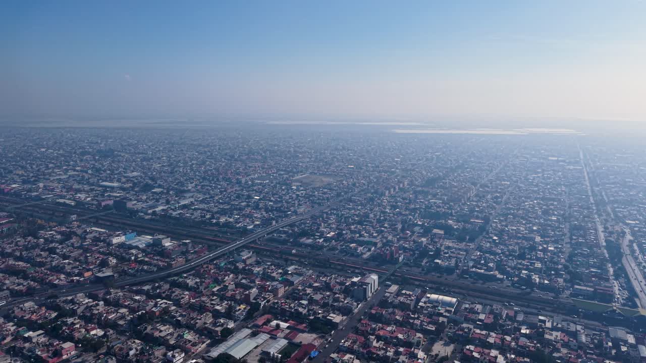 High drone view of smog-covered Ecatepec’s dense urban zone
