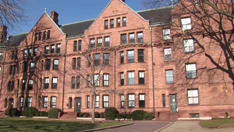 the camera pans across some of the buildings on harvard's campus