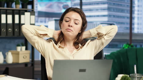 woman ceo dealing with muscle cramps due to incorrect posture at the desk