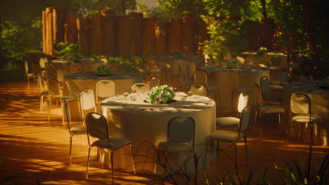 outdoor wedding reception with white tablecloths and flowers in a garden setting