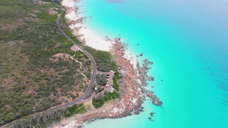 Campervans-pulling-into-carpark-at-Meelup-Beach-in-Dunsborough,-Western-Australia-on-perfect-summer-day