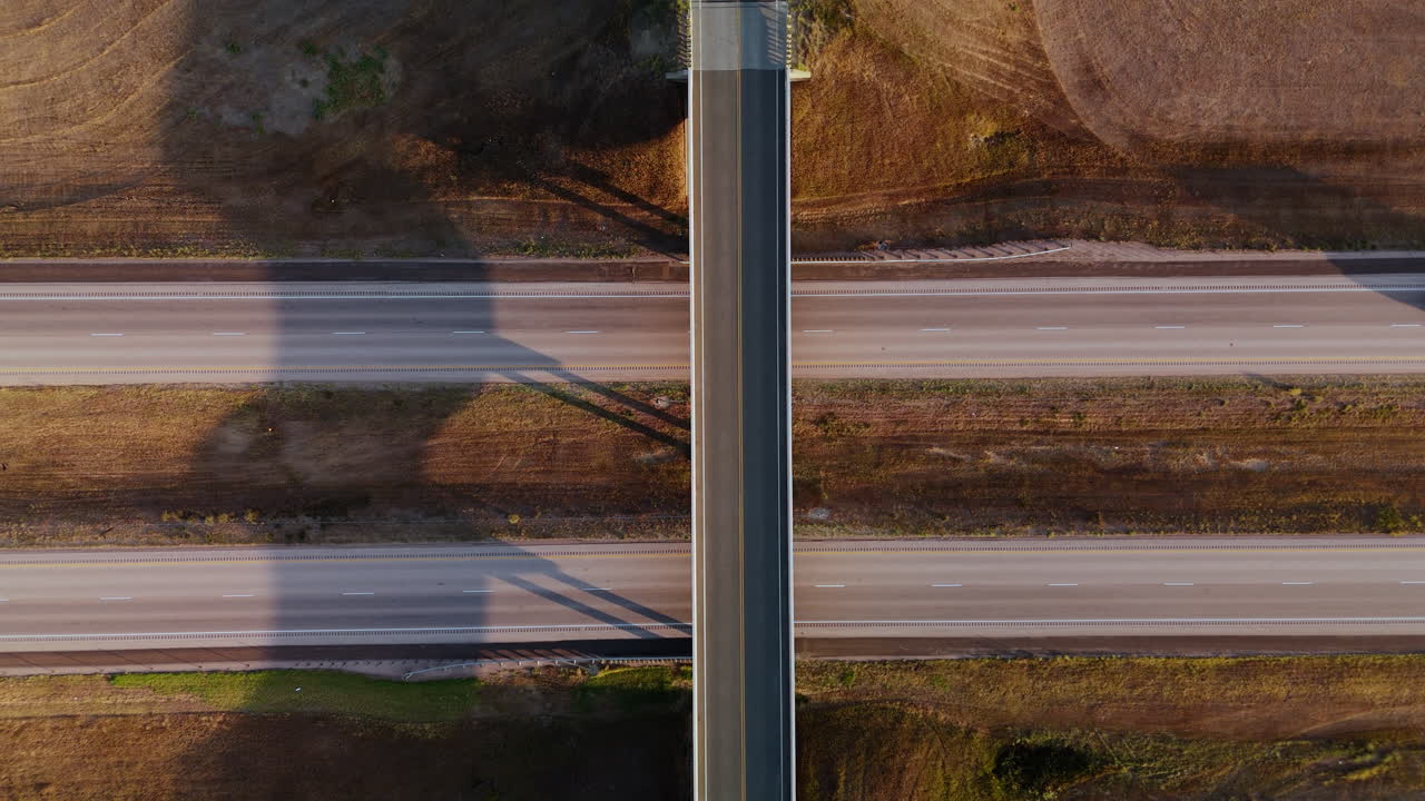 Aerial View of Highway Bridge Over Country Road
