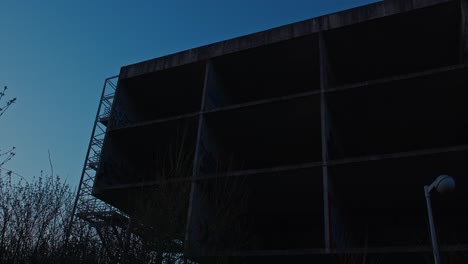 nightfall on abandoned hospital frame, zagreb croatia