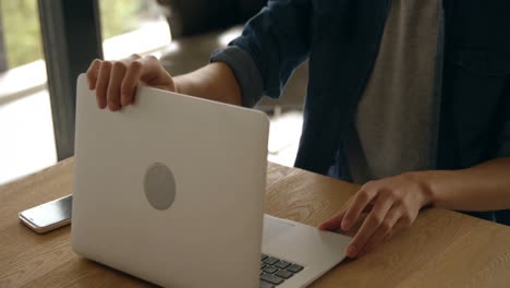 man using laptop at home 4k