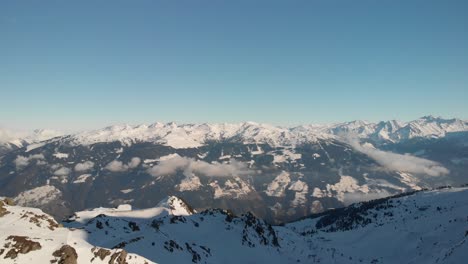 hochzillertal - austria aerials of the mountains and ski lines with blue skies in a sunny day