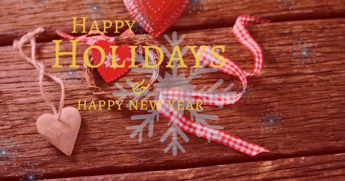 Animation of happy new year and holidays text against christmas decorative items on wooden surface