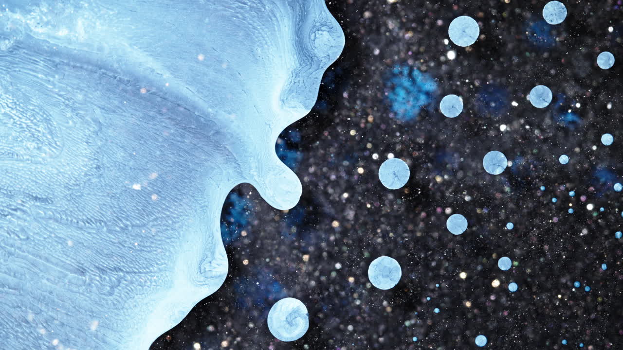 Abstract ink mixing in a macro shot creating vibrant flowing patterns