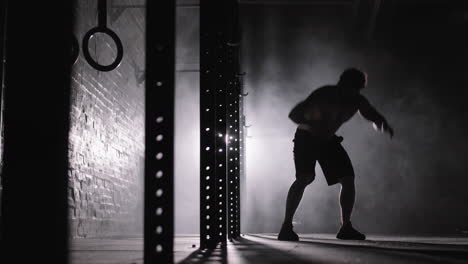 silhouette of sportsman doing burpee