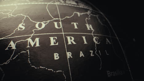 close-up of a vintage globe focused on south america