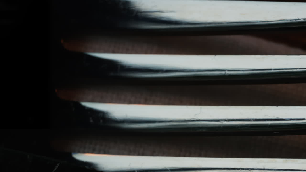 Close up of fork tines with soft reflections