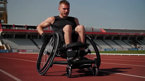 athlete in wheelchair racing on track