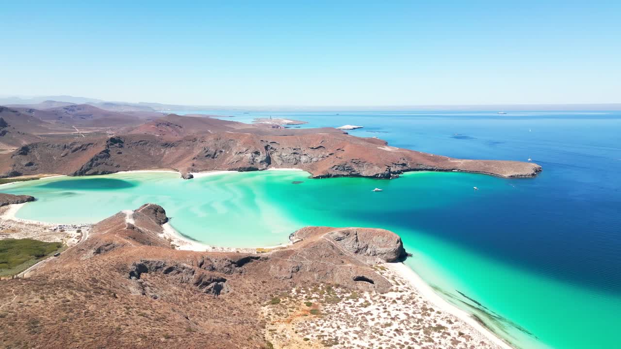 Clear turquoise water meets the desert landscape in Tecolotito, La Paz, Mexico