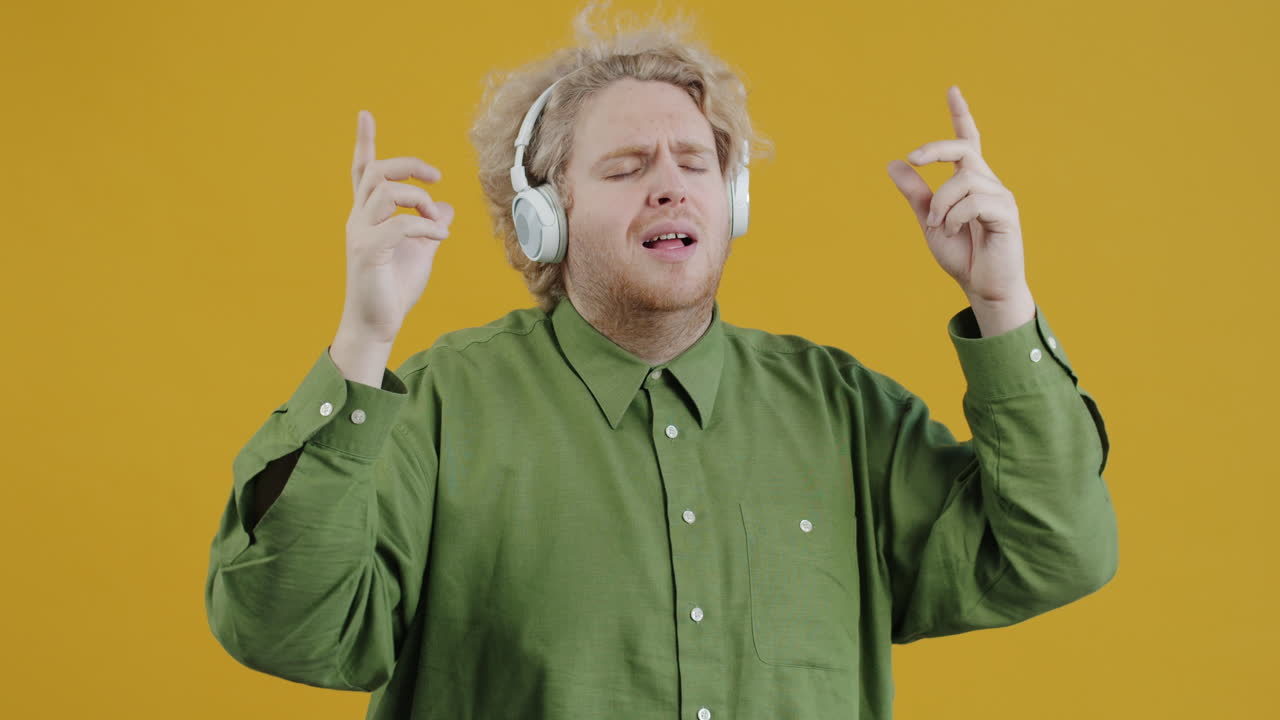 Man Dancing to Music with Headphones