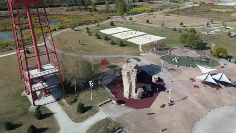 Aerial-orbit-of-Scioto-Audubon-Park-climbing-wall-and-wetland,-Columbus,-Ohio---Drone-4k