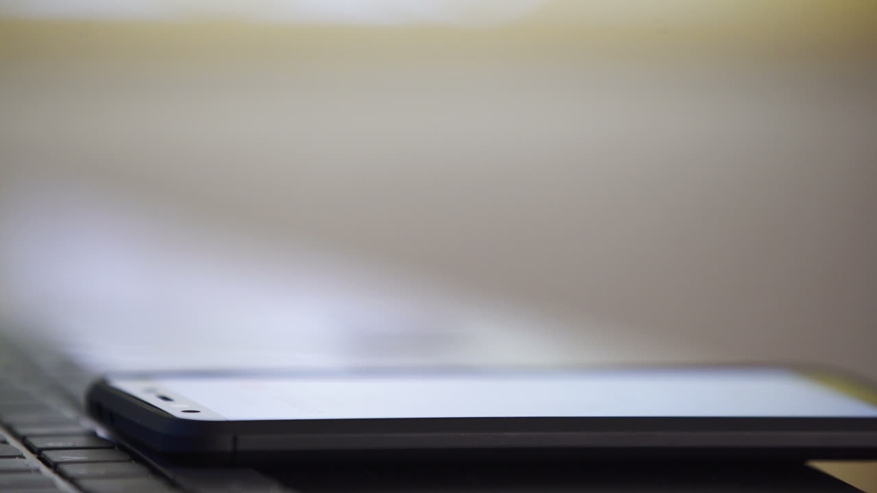 Close-up of a smartphone on a keyboard