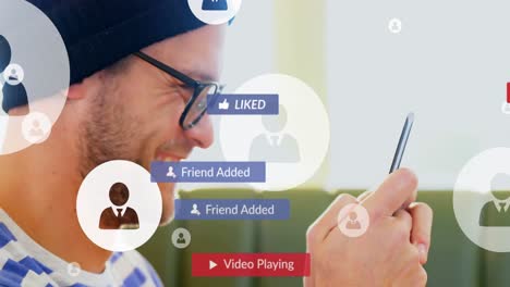 Animation-Von-Social-Media-Texten-Auf-Bannern-Mit-Digitalen-Symbolen-über-Einem-Mann,-Der-Ein-Smartphone-Nutzt