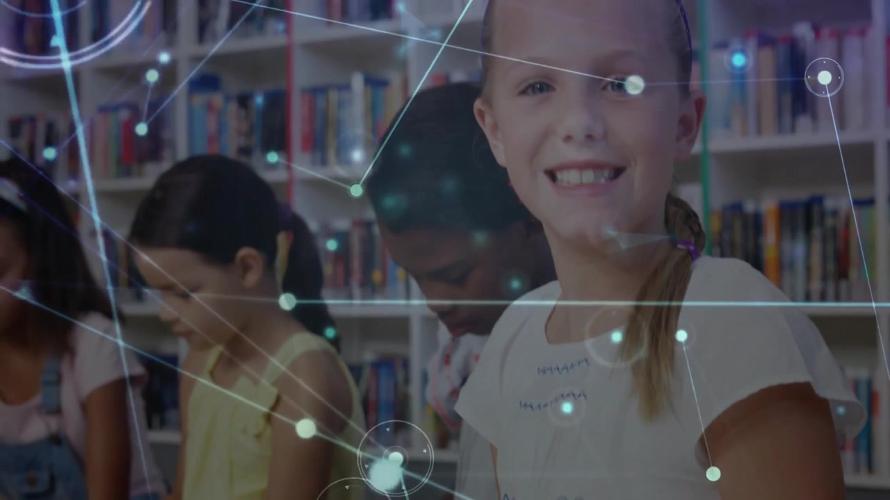 Four girls tapping tablets in library activating moving network visualization graphics for learning