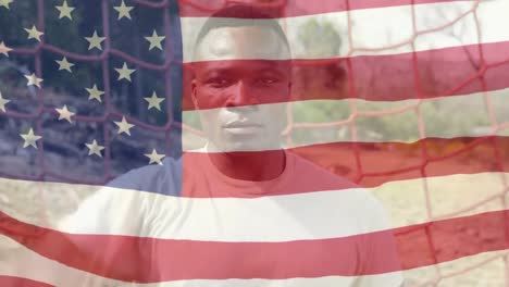 soldado afroamericano con nosotros ondeando la bandera en primer plano