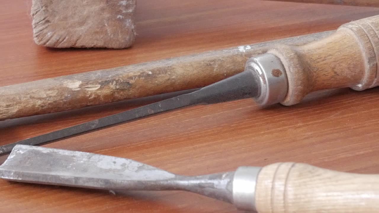 Old tools on wooden surface evoke history and craftsmanship