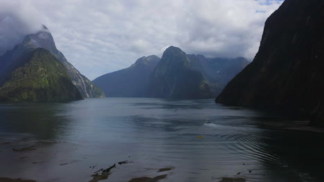 milford sound fjordland drone shot of the ocean with with mountains all around in new zealand