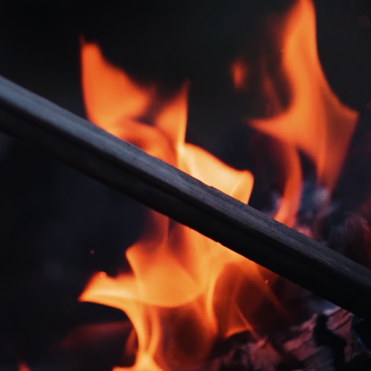 Burning fire. Bright burning wood slow motion. Splashes of flame and live coals.