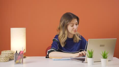 young woman making money sign with her hands.