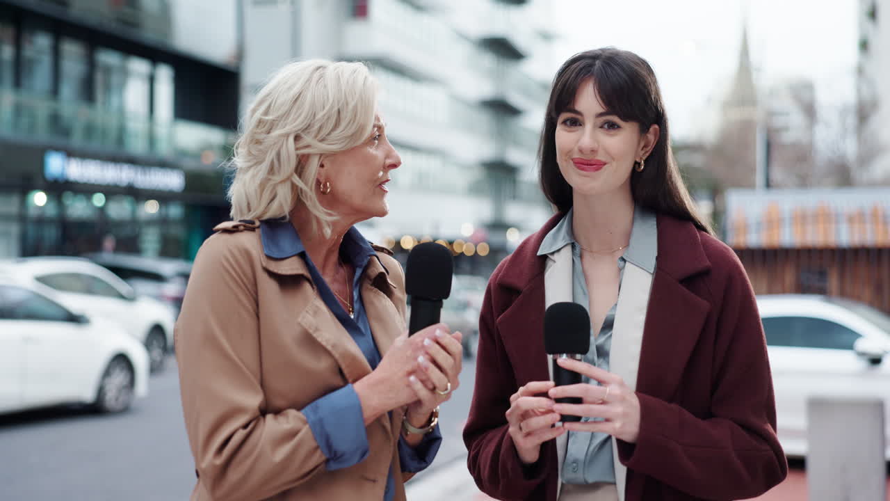 Two Female Journalists Conducting an Interview on a City Street