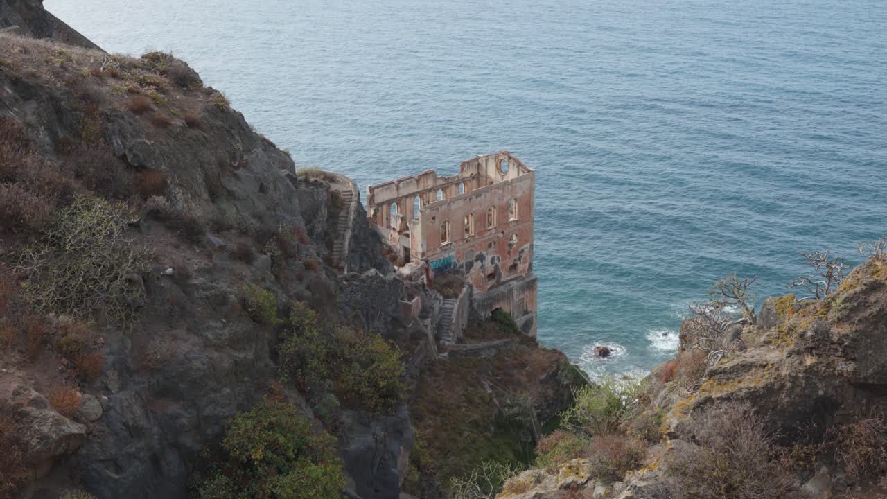 Old ruined building on a cliff next to the ocean in Gordejuela, Tenerife, Canary Islands, Spain.