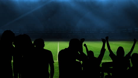 animation of silhouettes of sports fans cheering over sports stadium