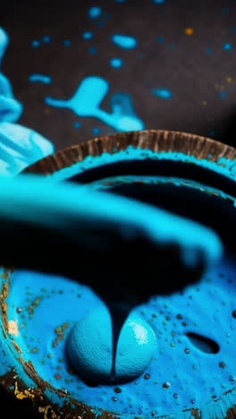 creative process with vibrant blue paint