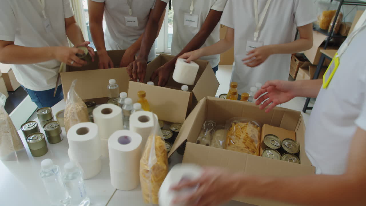 Volunteers Filling Box for Donation