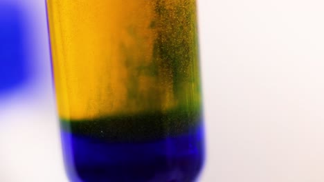 chemical reaction showing color change in solution