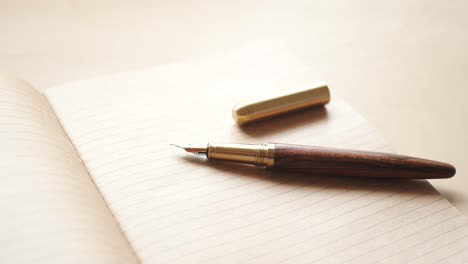 envelope , empty paper and fountain pen on table