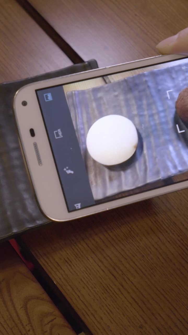 Hand Interacting with Augmented Reality Dessert on Smartphone