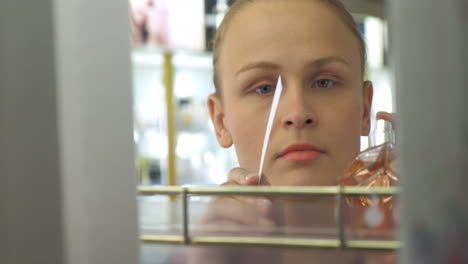 young woman in perfumery shop