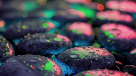 wet pebbles reflecting vibrant neon colors, transforming surface with glistening water drops, creating mesmerizing meditative visual experience in close up macro view