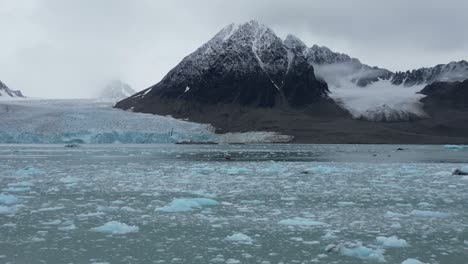 zodiac navigating in front of a glacier