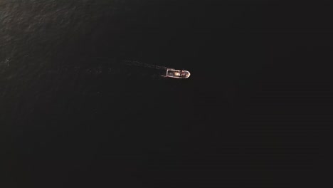 Aerial-Wide-Shot-Fishing-Boat-Floating-in-Deep-Blue-Mediterranean-Sea,-Fuengirola,-Spain