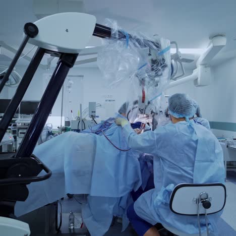 medical team performing surgical operation in bright modern operating room. modern equipment in operating room