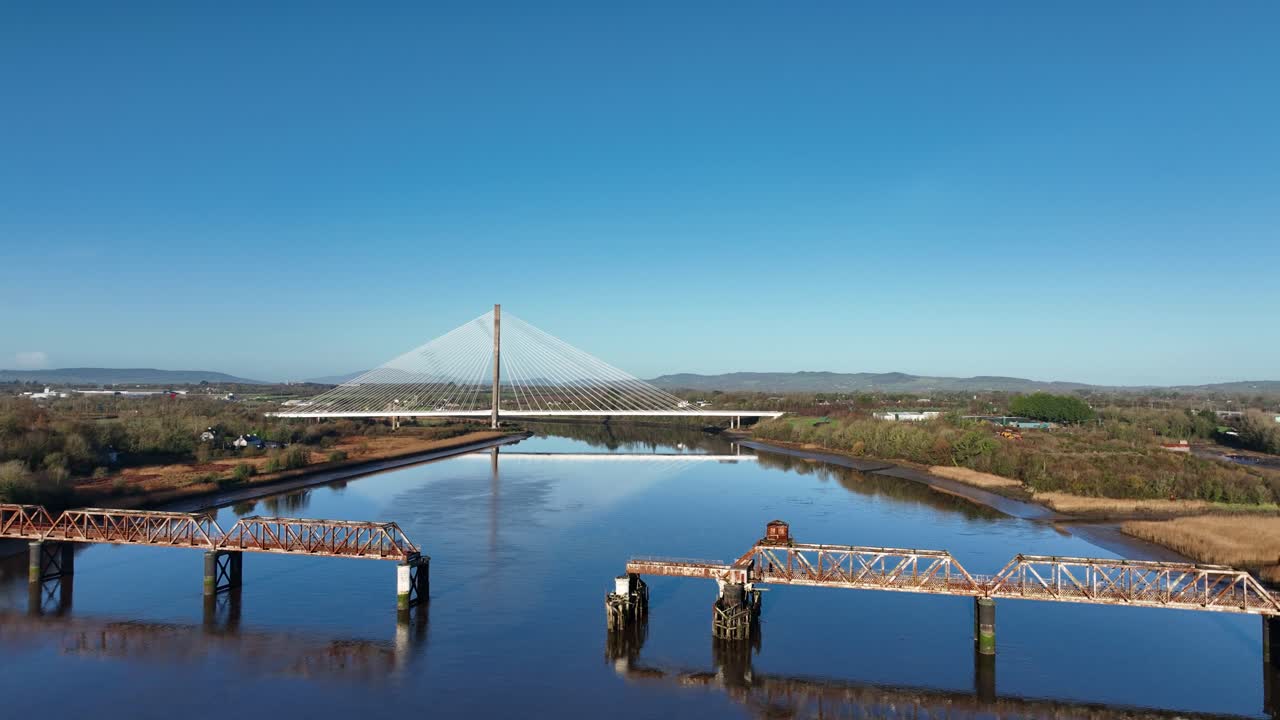 Ireland locations drone rising old and new transport bridges over the River Suir Waterford in Autumn morning crisp light
