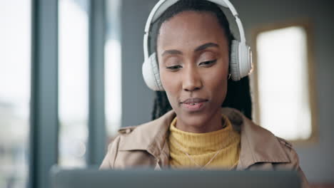 cafe, laptop and black woman with headphones