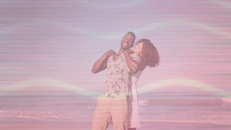 woman hugging man from behind on sandy beach at sunset, with animated heart icons for travel