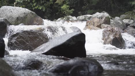 slow motion river stream in a tropical forest on a cloudy day